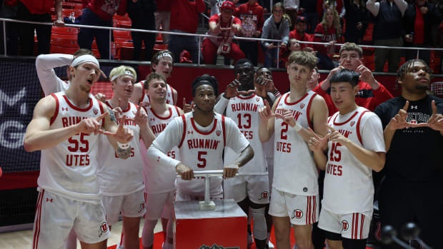 Caption: Jan 21, 2024; Salt Lake City, Utah, USA; Utah Utes guard Deivon Smith (5) Lights the U on the mountain outside of the Jon M. Huntsman Center after defeating the Oregon Ducks. Mandatory Credit: Rob Gray-USA TODAY Sports